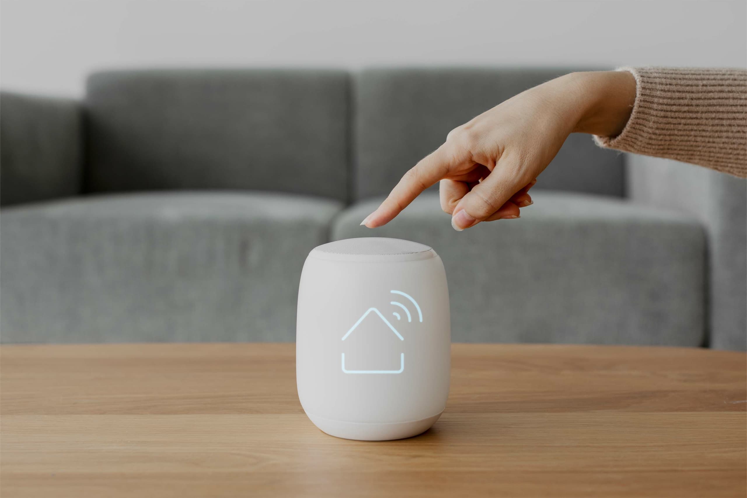 Control4 smart home touchscreen controlling lighting and entertainment in a modern living room